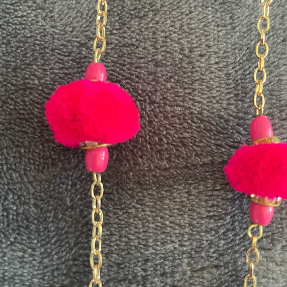 Necklace with dark pink pom poms very unique and beautiful brand new necklace